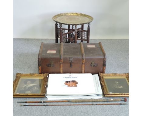 An early 20th century travelling trunk, together with a pair of prints, an Indian brass top occasional table, 62cm diameter, 