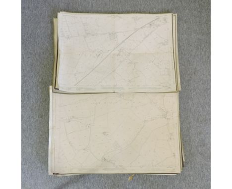 A collection of ordnance survey maps, unframed
