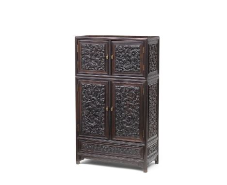 A RARE IMPERIAL ZITAN 'DRAGON' CABINET, KANGGUI18th century The cabinet of rectangular shape with square corners, inset on fr
