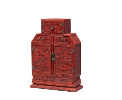 A RARE CARVED CINNABAR LACQUER CABINETQianlong/JiaqingThe rectangular cabinet with canted shoulders containing two drawers, w