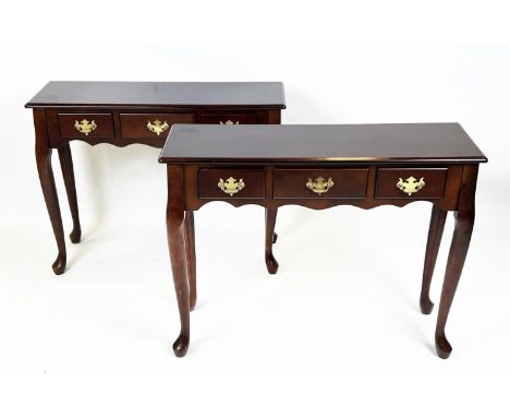CONSOLE TABLES, a pair, George III design, mahogany each with three drawers, 69cm H x 92cm W x 30cn D. (2) 