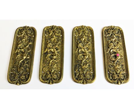 SET OF FOUR BRASS DOOR FINGER PLATES, Art Nouveau style, cast, each depicting a cherub amongst scrollwork, each 20cm x 7.5cm.