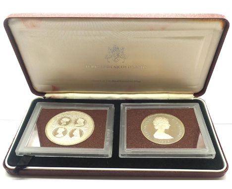 Turks and Caicos Islands cased two 20 crowns. P&amp;P Group 0 (£5+VAT for the first lot and £1+VAT for subsequent lots) 
