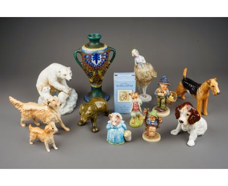 A Gouda twin handled baluster vase, shape no.55, two Hummel figures, an early 20th century German porcelain half dol pin cush