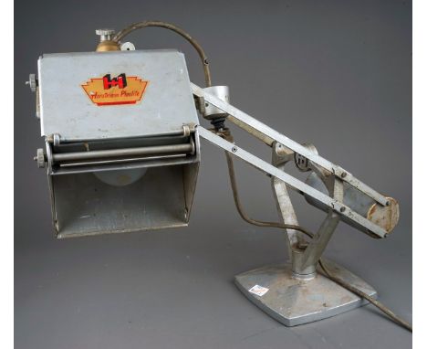 A vintage Hadrill &amp; Horstmann Pluslite counterbalanced desk lamp, fitted with   magnifying lens to the shade, metallic si