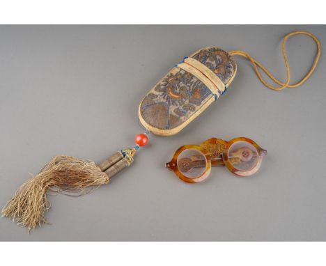 19th Century Chinese folding horn rimmed spectacles, in case.  The case is embroidered with silver bullion thread.  Silk tass