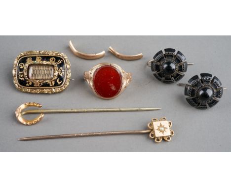 A 19th century mourning brooch, black enamel border inscribed 'In Memory Of', with a plait of hair to centre; a pair of Victo