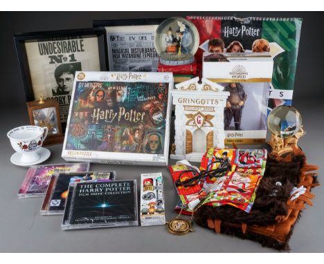 Harry Potter memorabilia to include: The History of Magic snow globe; boxed Rubeus Hagrid figure; Harry Potter jigsaw puzzle;
