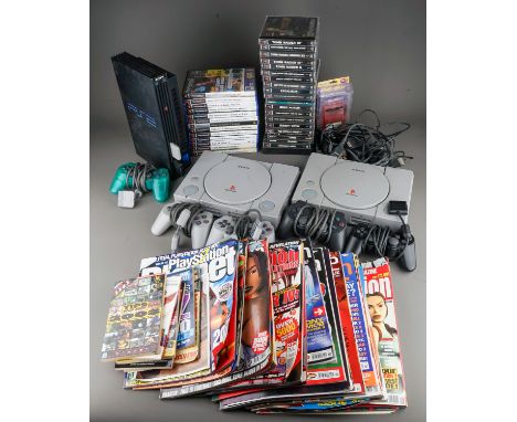 Two Sony PlayStation 1s and a Sony Playstation 2 game consoles with five controllers together with assorted PlayStation 1 and