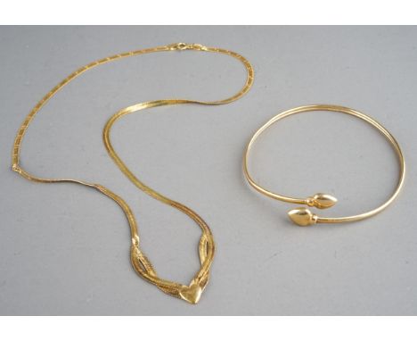 A 9ct yellow gold necklace, approx 3.3g; and an unmarked yellow metal bangle, approx 3.2g (2) 