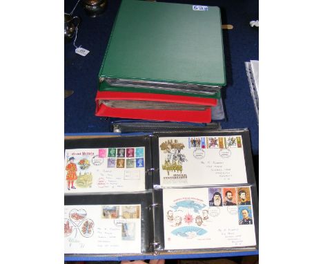 Four folders of commemorative First Day Covers, together with an album of collectable stamps