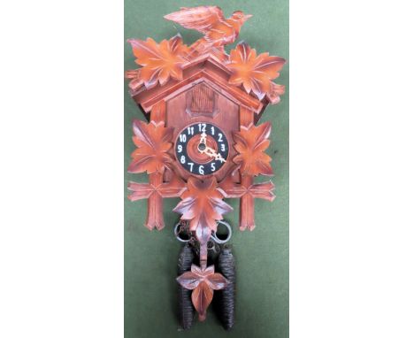 Wooden cased decorative cuckoo style wall clock with weights. Approx. 42cm H
Reasonable used condition, not tested for workin