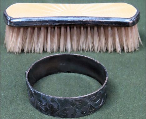 Hallmarked silver snap bangle, plus enamelled clothes brush
Both in reasonable used condition