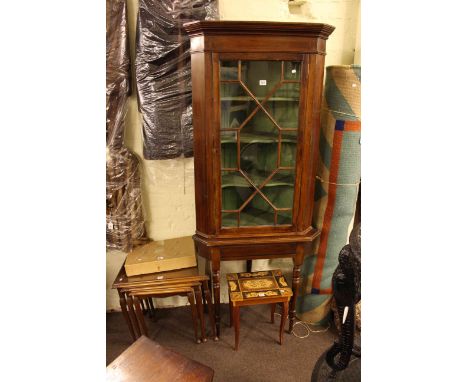 Astragal glazed corner cabinet on stand, nest of three tables and musical trinket table (3)