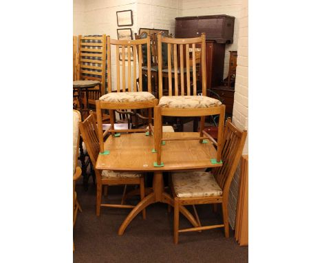 Ercol light elm pedestal dining table and four chairs