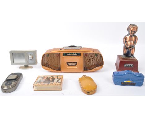 An assortment of vintage 20th century Novelty miscellaneous cigarette pocket &amp; table lighters. The lot to include a boomb