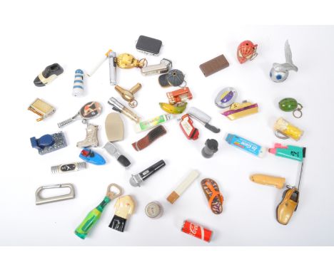 A large collection of vintage 20th century Novelty miscellaneous cigarette pocket lighters. The lot to include Coca-Cola ligh