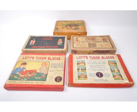 A collection of 20th century puzzles and games to include a two Chad Valley Great Western Railway jig-saw puzzles including '
