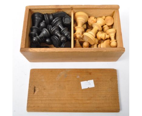 A vintage 20th Century turned wood chess pieces. All pieces are present, Queen, King, pawn, bishop, knight and rook. With a s
