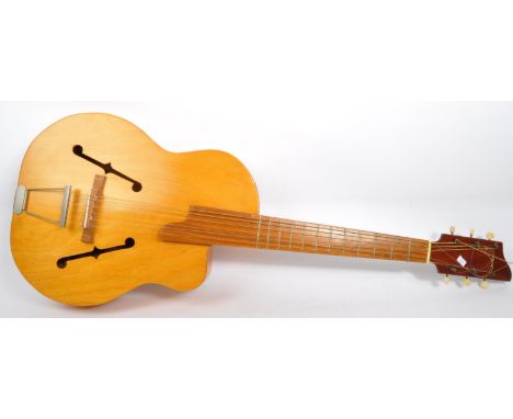 A vintage 20th century handmade arch top jazz blonde acoustic guitar with&nbsp;nickel plate tail piece.&nbsp;