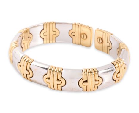 A TWO TONE CUFF BANGLE
Featuring a two tone cuff bangle, likely yellow gold and stainless steel, indistinctly marked '750' fo