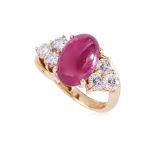 A RUBY CABOCHON AND DIAMOND RING