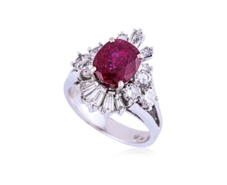 A VIVID RED RUBY AND DIAMOND RING
Featuring a oval cut ruby weighing approximately 2.60 Cts, of a vivid red colour, mounted i
