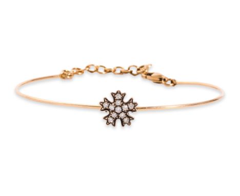 A DIAMOND 'FLOWER' BANGLE
Featuring round brilliant cut diamonds totalling approximately 0.15 Cts, mounted in a rose gold set
