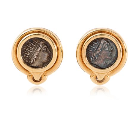 A PAIR OF ANCIENT COIN 'MONETE' CLIP EARRINGS BY BULGARI
Featuring a pair of bezel set ancient coins, mounted in a yellow gol