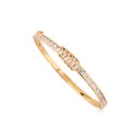 A HIGH KARAT GOLD DIAMOND HINGED BANGLE