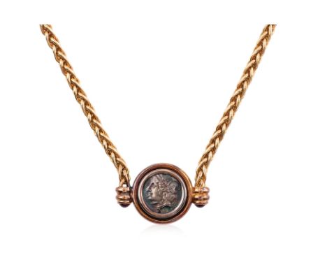 AN ANCIENT COIN 'MONETE' NECKLACE BY BULGARI
Featuring a bezel set ancient coin, mounted in a yellow gold setting marked '750