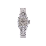 A MOVADO LADY'S DIAMOND SET COCKTAIL WATCH
