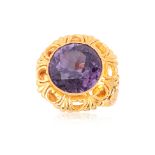 A SYNTHETIC SAPPHIRE HIGH KARAT GOLD RING