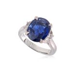 A VIVID BLUE SAPPHIRE AND DIAMOND THREE STONE RING