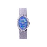A CHOPARD LADIES WHITE GOLD AND DIAMOND COCKTAIL WATCH WITH OPAL DIAL