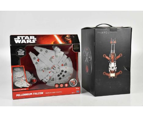 STAR WARS; a Propel 74-Z speeder bike quadcopter drone, with a Millennium Falcon remote control model, both boxed (2)