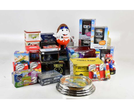 A collection of pop culture items including mugs, clocks, display items, figures, etc, featuring Super Mario, DC, The Simpson