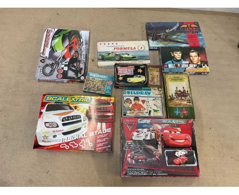 A collection of table top racing games, board games, jigsaws and others, including Micro Scalextric Cars 2 set, Waddingstons 