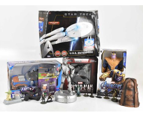 A collection of pop culture memorabilia, including a Corinthians Paul Merson figure, signed, a Star Trek ship, Fantastic 4 Th