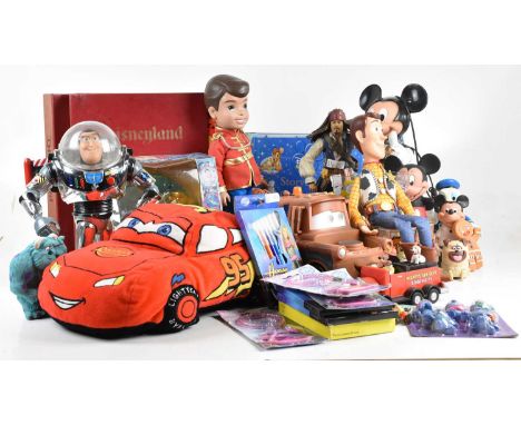 A collection of Disney toys, figures, stationery, etc, including Mickey Mouse telephone, chrome Buzz Lightyear and Woody figu