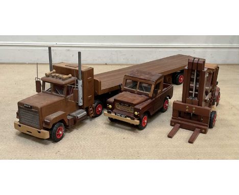 Three scratch built wooden vehicles including fork lift truck, Land Rover Defender and American big rig (3)