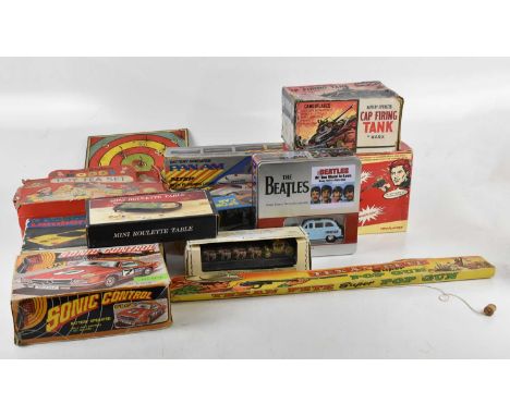 A collection of vintage toys including Texan Pete Super Pop Gun, Marx cap firing tank, Sedan Mercades Benz, a Lucky Sports Ca