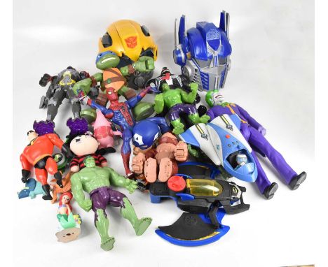 A collection of loose action figures including Batman, Teenage Mutant Ninja Turtles, Spider-Man, Power Rangers, etc.