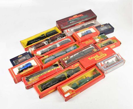 A collection of boxed OO gauge locomotives and rolling stock, including Hornby Legends LNER Flying Scotsman's, limited editio