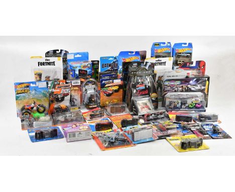 A collection of vehicles and figures, from franchises including The Hobbit, Star Trek, Ghostbusters, G.I. Joe, Batman, Call O