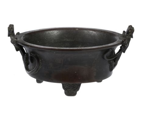  A bronze censer, Ming Dynasty or later  , supported on four feet, with applied long-tailed mythical beasts to the rim, apocr