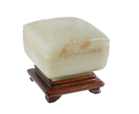  A celadon jade square box and cover, probably Qianlong  , the cover carved with a figure within key-fret borders, 7cm diamet