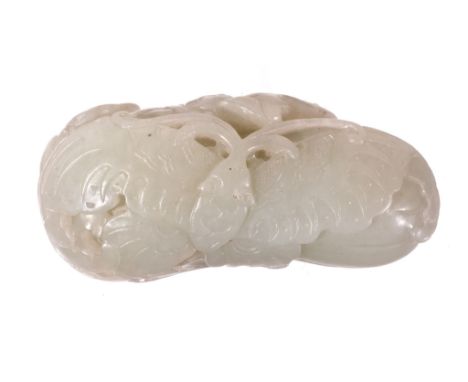  A celadon jade butterfly group, 18th-19th century  , carved with the butterfly lying flat on a gourd or fruit and with trail