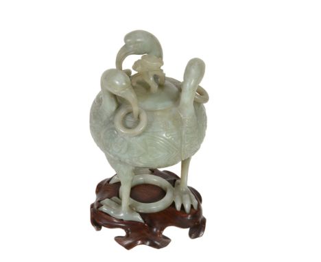  A celadon jade covered censer and cover  , the ovoid body carved with three birds each with rings around their beaks, on thr
