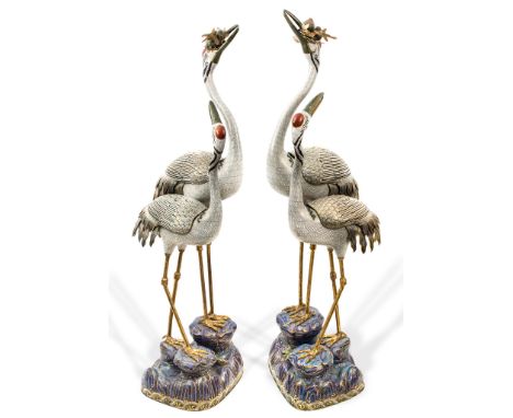 A pair of cloisonné enamel double crane censers, each group finely modelled as a large crane and young standing on an elabora